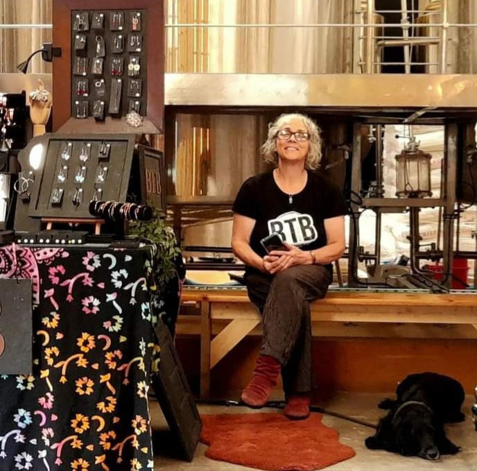 Carolyn and Harry,our black cocker spaniel at an event in The Two By Two tap Room 